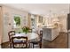 Eat-in kitchen with a view of the backyard, featuring stainless steel appliances, an island and modern finishes at 568 Timberland Dr, Atlanta, GA 30342