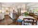Bright kitchen boasting stainless steel appliances, a marble-top island, and an adjacent breakfast area with backyard view at 568 Timberland Dr, Atlanta, GA 30342