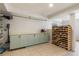 Functional laundry area with cabinets, countertop, and wine storage for added convenience at 568 Timberland Dr, Atlanta, GA 30342