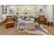 Cozy living room with a bay window, neutral furniture, and a decorative zebra-print rug at 568 Timberland Dr, Atlanta, GA 30342