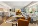 Open-concept living room with built-ins, a neutral sofa, and comfortable seating near the bay window at 568 Timberland Dr, Atlanta, GA 30342