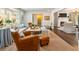 Bright living room with hardwood floors, a fireplace, and large windows with natural light at 568 Timberland Dr, Atlanta, GA 30342