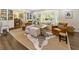 Bright living room featuring a large bay window, built-in shelving, and a zebra-patterned rug at 568 Timberland Dr, Atlanta, GA 30342
