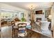 Bright living space with a bay window, a fireplace, and seating near a dining area at 568 Timberland Dr, Atlanta, GA 30342