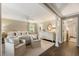 Spacious main bedroom featuring neutral tones, a ceiling fan, and dark hardwood floors at 568 Timberland Dr, Atlanta, GA 30342