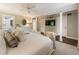 Large main bedroom featuring a king bed, accent chairs, and en-suite bathroom access at 568 Timberland Dr, Atlanta, GA 30342