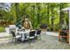 Outdoor dining area with grill, play structure, and comfortable seating for Gathering gatherings at 568 Timberland Dr, Atlanta, GA 30342