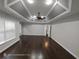 Large bedroom features trey ceilings and dark wood floors at 7030 Bennington Ln, Cumming, GA 30041