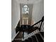 Spacious foyer with high ceilings, chandelier, dark hardwood floors, and view to the front door and upper level at 7030 Bennington Ln, Cumming, GA 30041