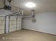 Spacious two-car garage with white doors and garage door opener visible at 7030 Bennington Ln, Cumming, GA 30041