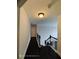 Hallway with staircase and dark wood floors at 7030 Bennington Ln, Cumming, GA 30041