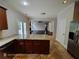 Granite countertops and stainless appliances in eat-in kitchen at 7030 Bennington Ln, Cumming, GA 30041