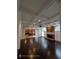 Open living space with stone fireplace and views into eat-in kitchen at 7030 Bennington Ln, Cumming, GA 30041