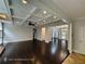 Spacious living room with decorative ceiling, recessed lighting, hardwood floors, and open archways to other rooms at 7030 Bennington Ln, Cumming, GA 30041