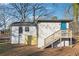 Backyard featuring a deck with stairs leading up to the house with neutral siding at 1870 Oak Valley Rd, Decatur, GA 30035