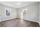 This bedroom features hardwood floors, neutral walls, and windows for ample natural light at 1870 Oak Valley Rd, Decatur, GA 30035