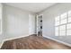 This bedroom features hardwood floors, neutral walls, and closet space at 1870 Oak Valley Rd, Decatur, GA 30035