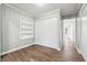 Bedroom featuring a built-in bookshelf and a convenient closet at 1870 Oak Valley Rd, Decatur, GA 30035