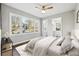Sun-filled bedroom showcasing a large window, neutral decor, and hardwood floors at 1870 Oak Valley Rd, Decatur, GA 30035