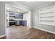 Open dining area flowing into a kitchen with stainless appliances and painted cabinets at 1870 Oak Valley Rd, Decatur, GA 30035