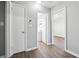Hallway showcasing access to the modern bathroom and a room with stylish floors at 1870 Oak Valley Rd, Decatur, GA 30035