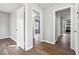 Hallway showcasing the home's open layout and connecting various living spaces with wood flooring at 1870 Oak Valley Rd, Decatur, GA 30035