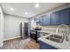 Modern kitchen with stainless steel appliances, granite countertops, and painted cabinets at 1870 Oak Valley Rd, Decatur, GA 30035