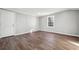 Bright living room features beautiful wood flooring and a large window at 1870 Oak Valley Rd, Decatur, GA 30035