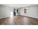 Spacious living room boasts stylish flooring and an open view to the kitchen at 1870 Oak Valley Rd, Decatur, GA 30035