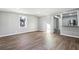 Open living space with wood floors and a view to the kitchen area at 1870 Oak Valley Rd, Decatur, GA 30035