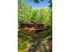 Well-maintained backyard with a spacious wooden deck and verdant landscaping at 2208 Guinevere Ne Way, Atlanta, GA 30345