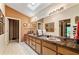 Spacious bathroom featuring dual vanities, tile countertops, and a skylight at 2208 Guinevere Ne Way, Atlanta, GA 30345