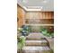 Bathroom with skylight features a sunken tub with retro tile and wood paneling at 2208 Guinevere Ne Way, Atlanta, GA 30345