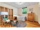 Cozy bedroom with hardwood floors, a full bed, and unique decorative ceiling tiles at 2208 Guinevere Ne Way, Atlanta, GA 30345