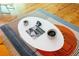 Coffee table with cups, bowls, and a book on a designed rug at 2208 Guinevere Ne Way, Atlanta, GA 30345