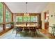 Open dining room with large windows, wood accents, and natural light at 2208 Guinevere Ne Way, Atlanta, GA 30345