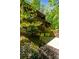 Beautiful view of the exterior of a two-story home with lots of greenery and mature trees surrounding the property at 2208 Guinevere Ne Way, Atlanta, GA 30345