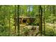 Well maintained property with stone accents and a balcony surrounded by lush greenery at 2208 Guinevere Ne Way, Atlanta, GA 30345