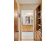 Hallway view with tile flooring leading to the bathroom and built-in storage unit at 2208 Guinevere Ne Way, Atlanta, GA 30345