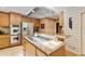 A well-appointed kitchen features stainless steel appliances and a gas cooktop on an island with granite counters at 2208 Guinevere Ne Way, Atlanta, GA 30345
