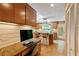An eat-in kitchen features an island, granite counters, backyard views, and a built-in desk space at 2208 Guinevere Ne Way, Atlanta, GA 30345