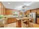 A well-lit kitchen features stainless steel appliances, granite counters, and an eat-in island with seating at 2208 Guinevere Ne Way, Atlanta, GA 30345