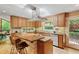 Modern kitchen featuring breakfast bar, stylish cabinetry, stainless steel appliances, and ample counter space at 2208 Guinevere Ne Way, Atlanta, GA 30345