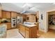 A spacious kitchen features stainless steel appliances, granite counters, and an island with a gas cooktop at 2208 Guinevere Ne Way, Atlanta, GA 30345