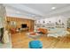 Open living space with stone fireplace, wood paneling, and an array of unique mid-century modern decor at 2208 Guinevere Ne Way, Atlanta, GA 30345