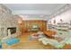 Living room with fireplace, shelving, and retro furniture at 2208 Guinevere Ne Way, Atlanta, GA 30345