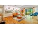 Living room with shelving, hardwood floors and sliders opening to trees at 2208 Guinevere Ne Way, Atlanta, GA 30345