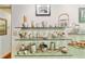 Shelving with metal tea set and other metal serving pieces at 2208 Guinevere Ne Way, Atlanta, GA 30345