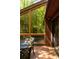 The outdoor deck blends effortlessly with the indoors through the ample light provided by the large sunroom windows at 2208 Guinevere Ne Way, Atlanta, GA 30345