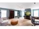 A bonus room features an elliptical, chair, bookcase, TV, and vaulted ceilings at 3011 Oak Hampton Ct, Duluth, GA 30096